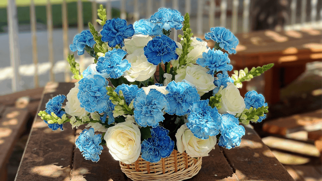 Elegant blue carnation bouquet in decorative vase on display