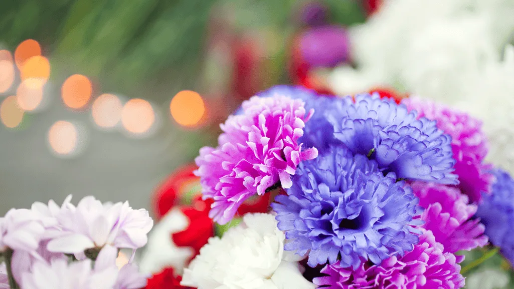 Fantasy-themed party decoration with blue carnations