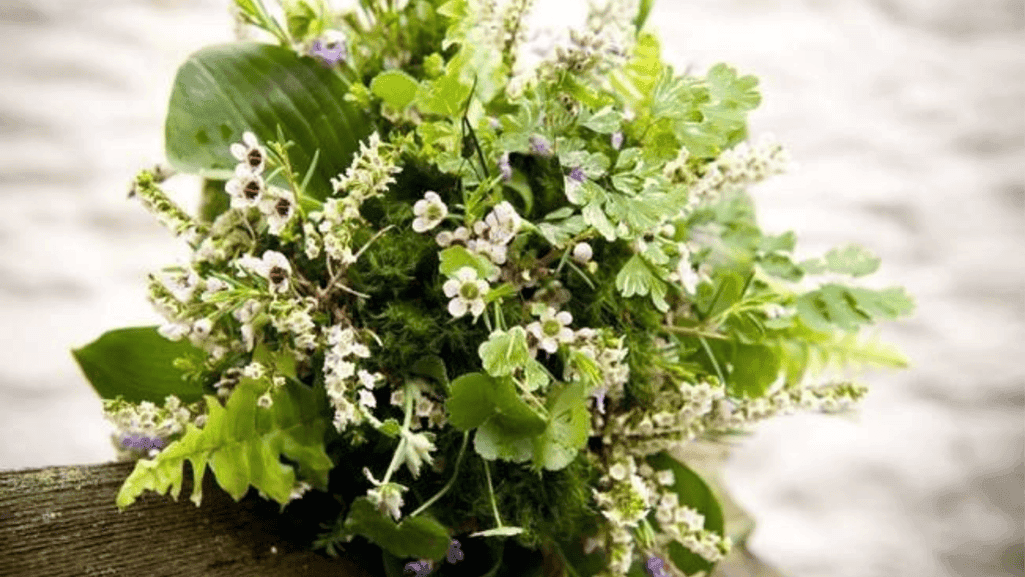 Waxflower paired with roses in an arrangement